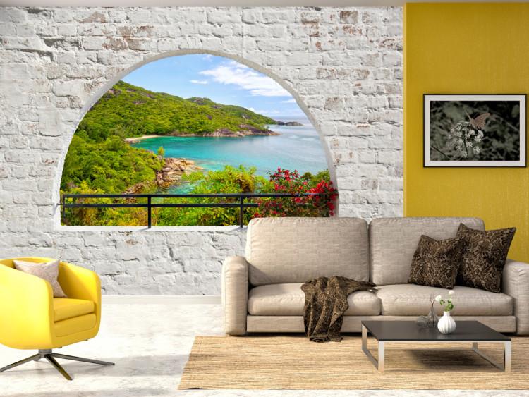 Mural de parede Vista da Janela - paisagem com mar turquesa e ilha cercada por tijolos brancos