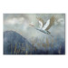 Quadro pintado A Heron in Flight - A Bird Flying Against the Background of Dark Blue Mountains Covered With Fog 151209
